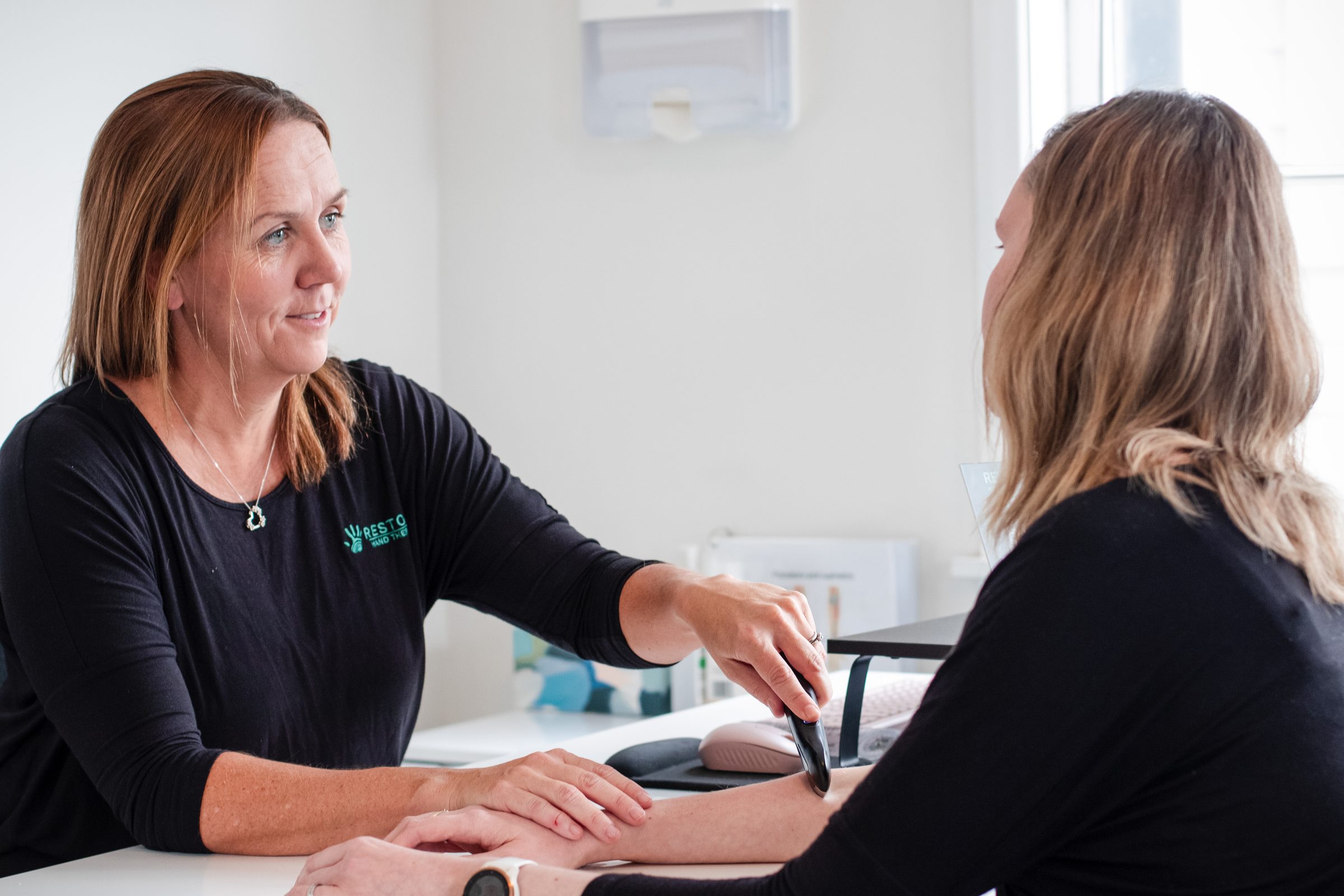A warm conversation between a Restore therapist and patient