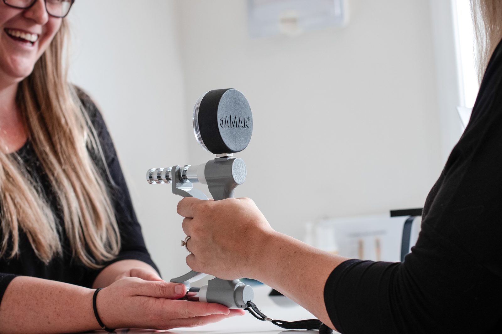 A grip-strength assessment at Restore Hand Therapy